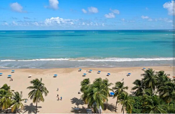 On the beach, sun-loungers, beach towels