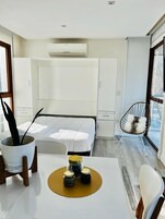 Deluxe Studio | Living area | 32-inch Smart TV with cable channels, heated floors