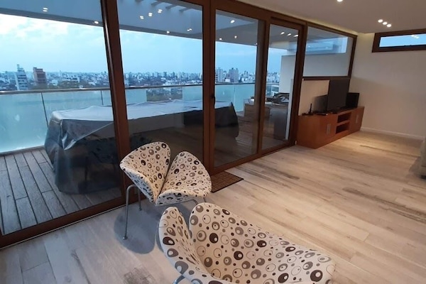 Presidential Apartment | Living area | 32-inch Smart TV with cable channels, heated floors