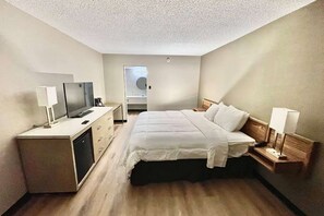 Desk, laptop workspace, blackout curtains, iron/ironing board