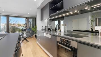 Deluxe Apartment | Private kitchen | Full-size fridge, oven, stovetop, dishwasher