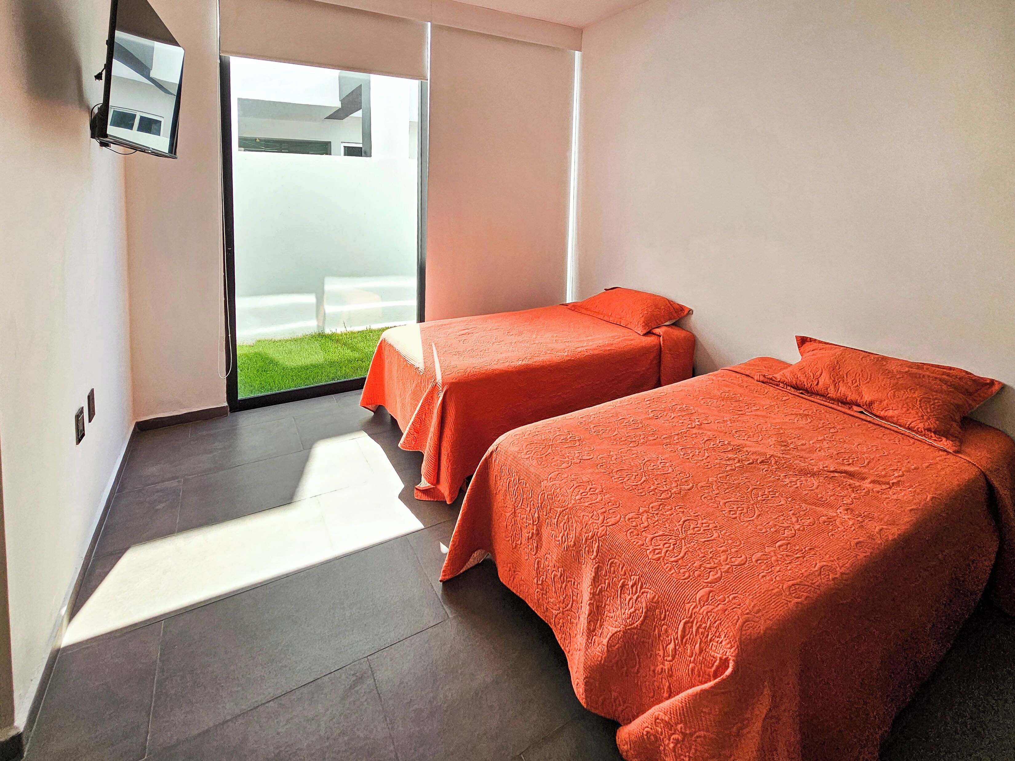 downstairs bedroom with tv