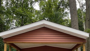 A small wooden cabin with a porch, a covered deck, and a white exterior trim. - Country Cabin by The Ark (Verona)