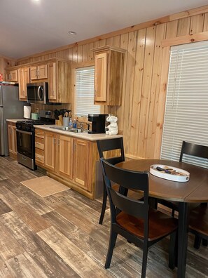 Fridge, microwave, stovetop, coffee/tea maker