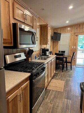 Fridge, microwave, stovetop, coffee/tea maker