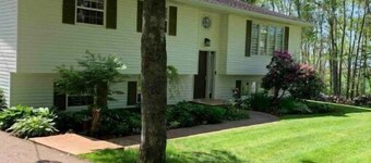 Beautiful split entry home in a wooded paradise!
