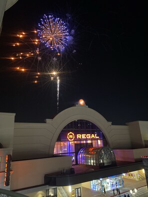 Experience the grandeur of Regal Hotel's elegant entrance, featuring an arched design and glass facade.