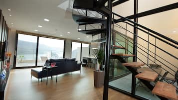 Basic Duplex | Living area | 50-inch flat-screen TV with cable channels, heated floors
