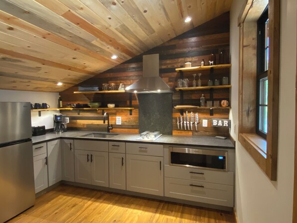 Fridge, microwave, stovetop, coffee/tea maker