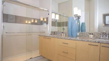 Bathtub, hair dryer, towels, shampoo