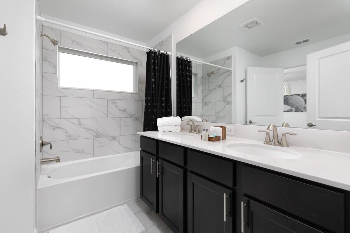 Bathtub, hair dryer, towels