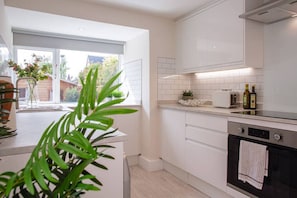 Enjoy cooking in this well-equipped kitchen with an oven and ample countertop space.