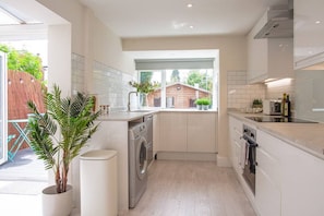Enjoy cooking in this kitchen with a large window offering a view of the backyard.