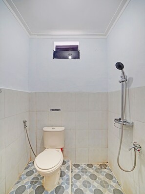 Habitación doble Deluxe | Baño | Regadera y toallas 