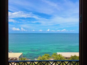 A view of the ocean from a balcony with a clear sky. - CASEPIA (Phu Quoc)