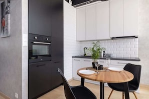 Fridge, oven, stovetop, dishwasher - Modern Studio with Terrace | Private Parking in Garage (Kraków)