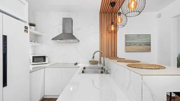 Fridge, microwave, stovetop, coffee/tea maker