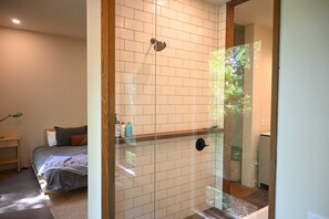 Bathtub, hair dryer, towels, shampoo