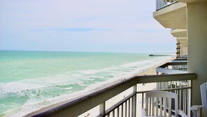 A balcony with a view of the beach and ocean. - Garden City Beach Oceanfront Condo 807 | Rising Tides Properties Rental (Murrells)