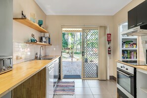 Enjoy cooking in this well-equipped kitchen with a toaster, oven, and microwave.