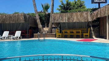 Outdoor pool, pool umbrellas, sun loungers