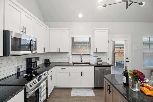 Fridge, microwave, oven, stovetop - Ethel's Digs with Hot Tub, Close to Main Street! (Fredericksburg)
