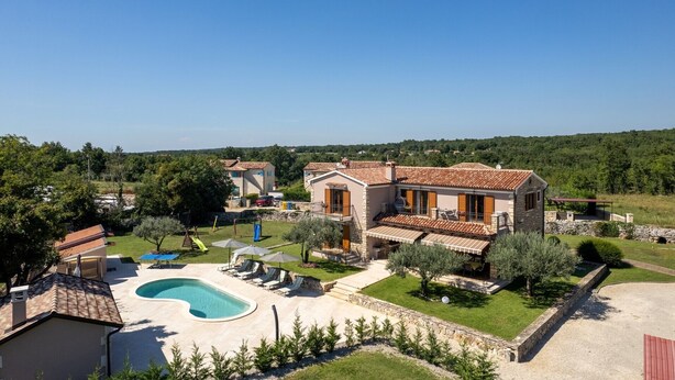 A two-story house with a swimming pool, outdoor seating, and a garden. - Enchanting Villa Marijanin Vrt with swimming pool (Tinjan)