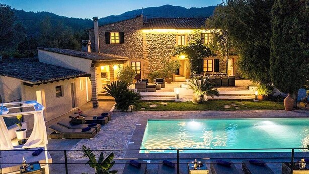 A stone house with a swimming pool, outdoor seating, and a garden. - Finca Romana by Vida Villas, Fabulous 6 bedroom Villa, Sleeps 12 (Pollença)
