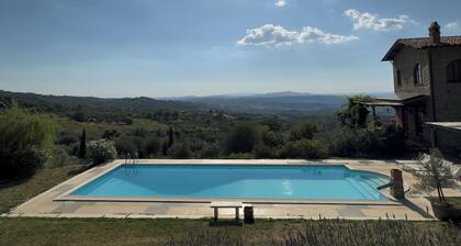 Villa and pool, next to typical Tuscan vineyards and olive groves, breathtaking sunsets