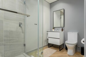 Shower, hair dryer, towels, soap