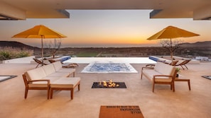 Outdoor pool, open 7:00 AM to 10:00 PM, pool umbrellas, sun loungers