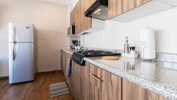 Fridge, microwave, stovetop, coffee/tea maker