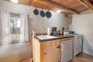 Fridge, stovetop, coffee/tea maker, cookware/dishes/utensils