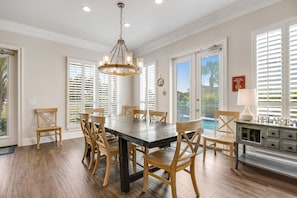Enjoy meals in this dining area with a large table and comfortable chairs.