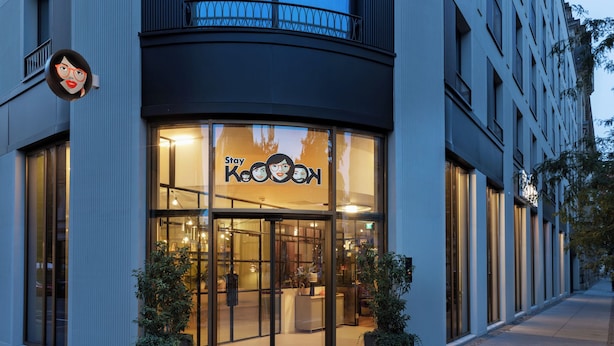 A modern building with a glass storefront displaying the sign "Stay KooKooN". - Stay KooooK Leipzig City – Online Check In (Leipzig)