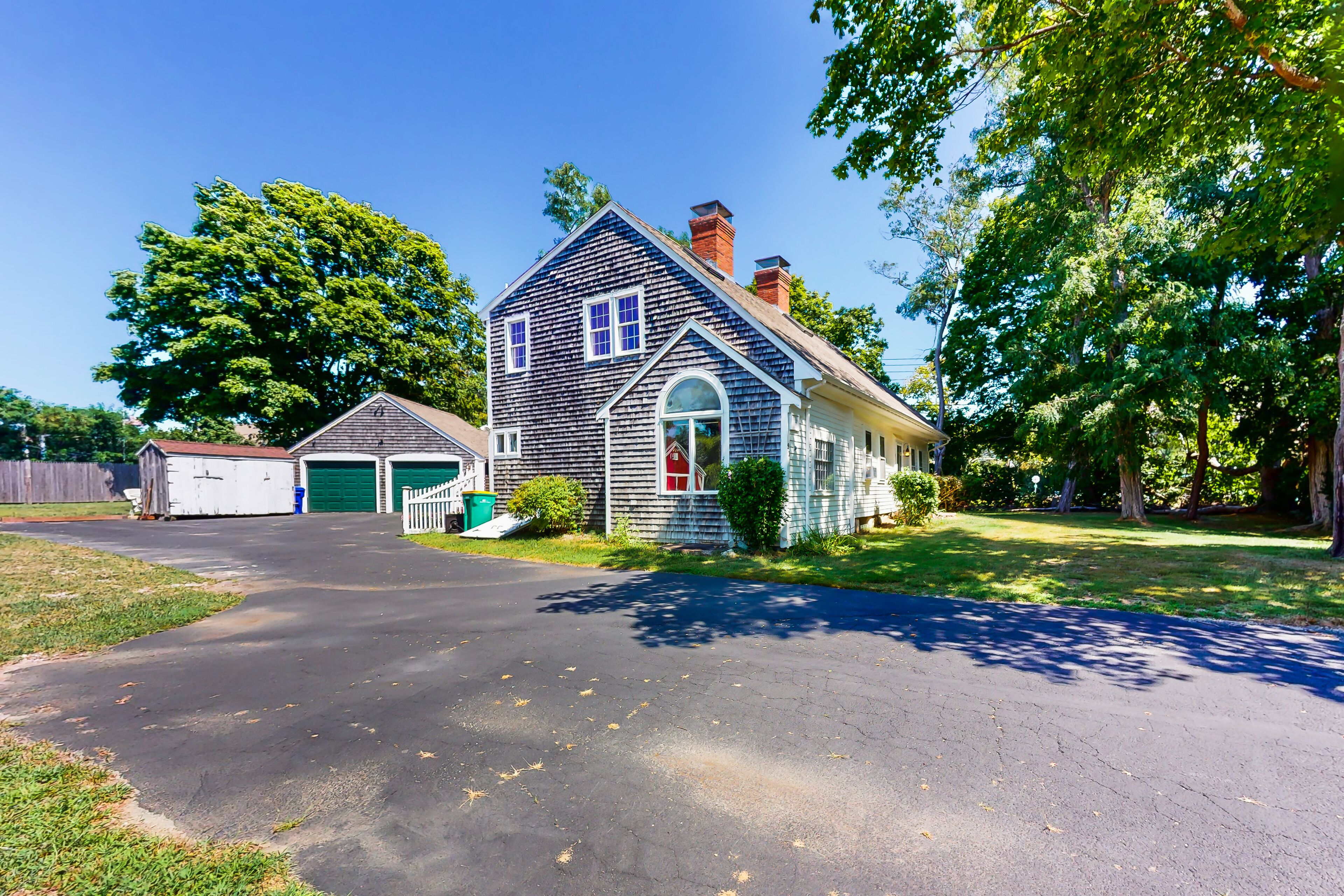 Historic, dog-friendly home with a full kitchen, furnished patio, & yard