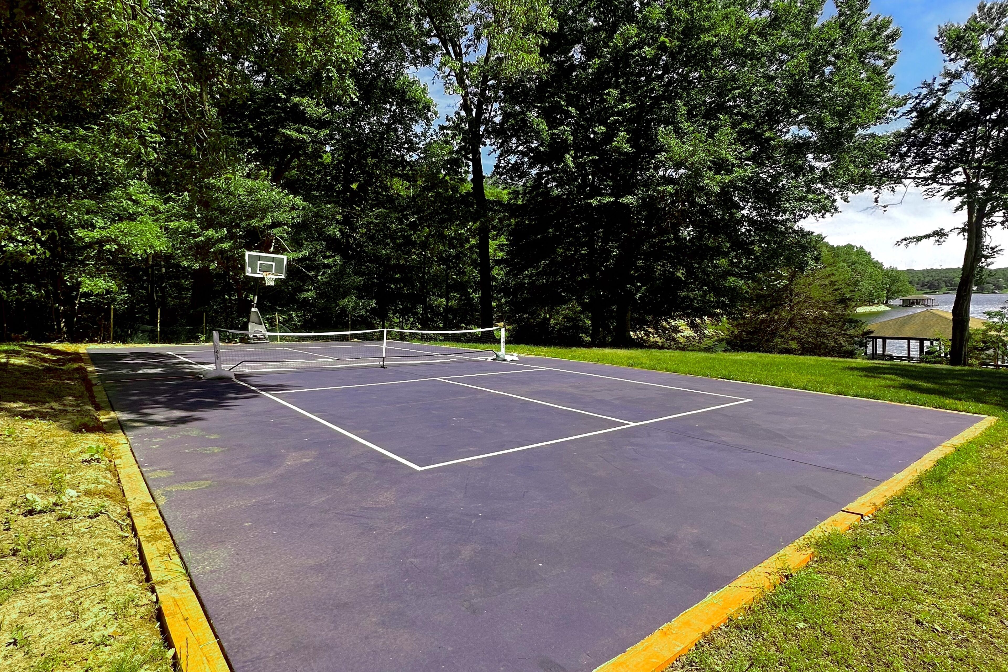 Lakefront home in private location with dock, firepit, game room & Pickleball!
