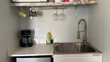 Fridge, microwave, stovetop, coffee/tea maker