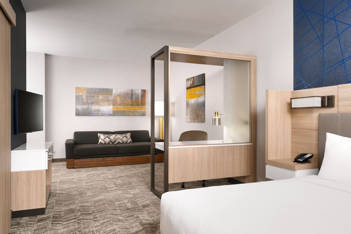 Hypo-allergenic bedding, desk, laptop workspace, blackout curtains