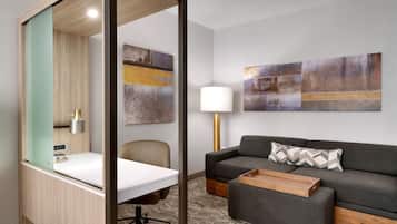 Hypo-allergenic bedding, desk, laptop workspace, blackout curtains