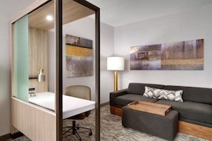 Hypo-allergenic bedding, desk, laptop workspace, blackout curtains