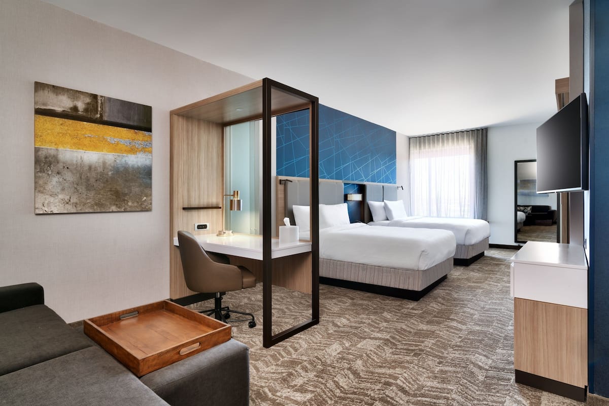 Hypo-allergenic bedding, desk, laptop workspace, blackout curtains