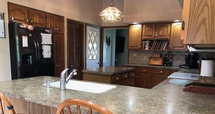 Glade Run House - A quiet country home retreat with a stream running through it.