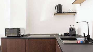 Fridge, microwave, stovetop, coffee/tea maker