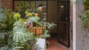 A building entrance with a sign reading "Circular Flats Cq. 1 # 68-86". - The Somos Flats Laureles (Medellín)