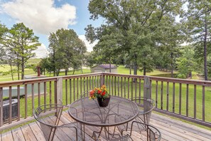 Enjoy a peaceful moment on this deck with a view of the surrounding landscape.