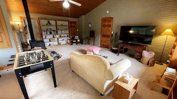 Smart TV, fireplace, foosball, books