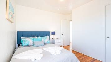 4 bedrooms, premium bedding, desk, laptop workspace