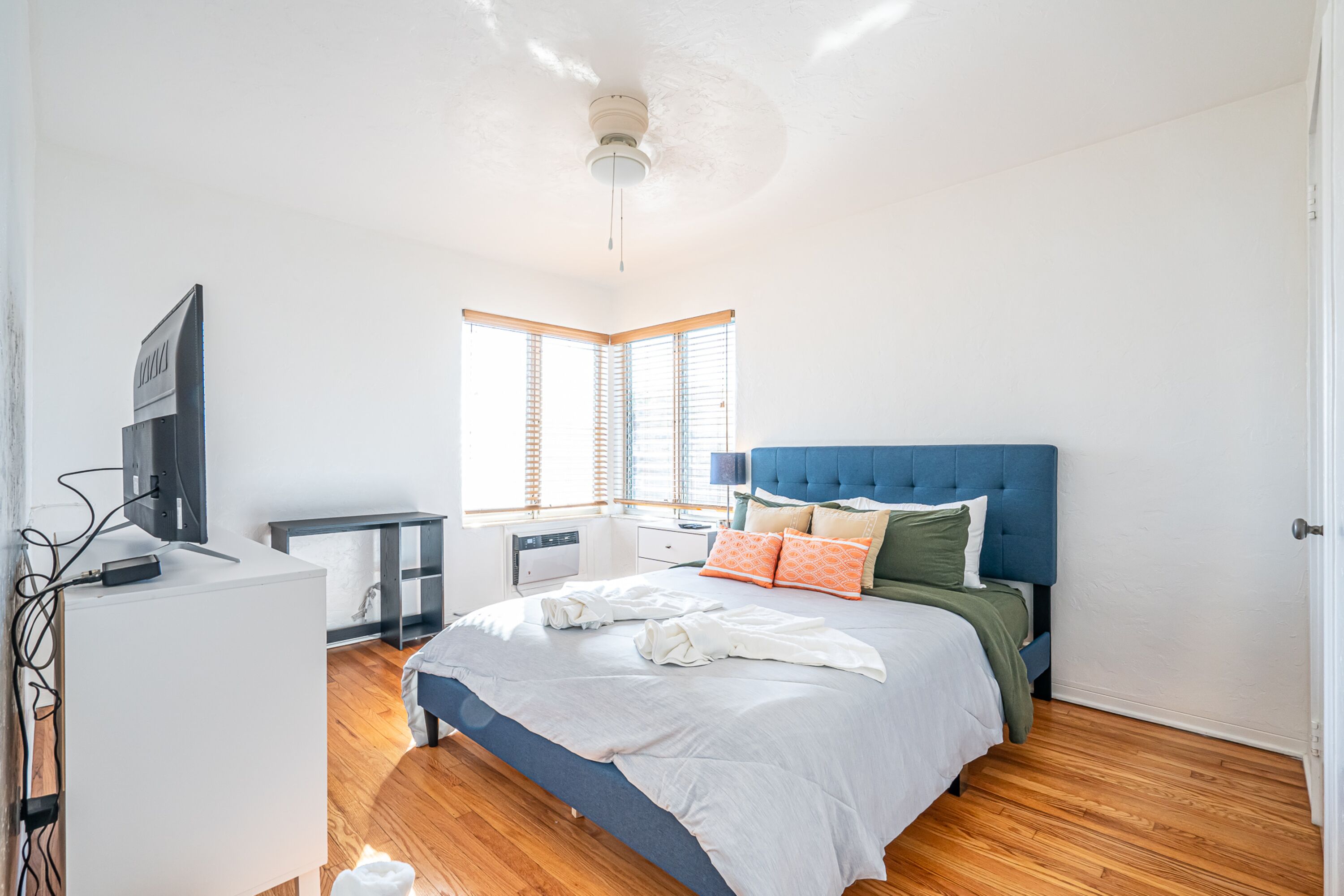Premium bedding, desk, laptop workspace, iron/ironing board
