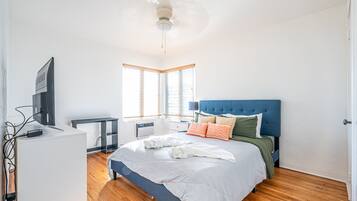 Premium bedding, desk, laptop workspace, iron/ironing board